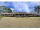 Ranch style home with mature landscaping and a covered front porch at 202 Heights Pl, Canton, GA 30114