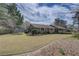 Ranch-style home with inviting curb appeal, spacious lawn, and a trampoline at 202 Heights Pl, Canton, GA 30114
