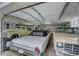 Spacious garage with three classic cars, showcasing a car enthusiast's dream at 202 Heights Pl, Canton, GA 30114