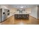 Gourmet kitchen with central island, stainless appliances, and ample storage space at 202 Heights Pl, Canton, GA 30114