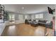 Living room featuring a large sofa, hardwood floors, and natural light at 202 Heights Pl, Canton, GA 30114