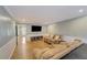 Inviting living room with a large TV, comfortable seating, and stylish decor at 202 Heights Pl, Canton, GA 30114