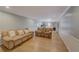 Spacious living room featuring hardwood floors, plush sofas, and ample natural light at 202 Heights Pl, Canton, GA 30114
