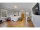 Large main bedroom featuring hardwood floors, a TV, and a seating area at 202 Heights Pl, Canton, GA 30114