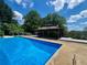 Inviting backyard pool with a gazebo and deck, perfect for outdoor entertaining and relaxation at 202 Heights Pl, Canton, GA 30114