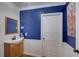 Charming powder room features a pedestal sink, beadboard detail, and blue accent wall at 202 Heights Pl, Canton, GA 30114