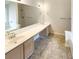 Large bathroom with double sinks and a garden tub at 7045 Treeline Dr, Cumming, GA 30028