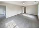 Large bedroom with ceiling fan and access to upper level at 7045 Treeline Dr, Cumming, GA 30028