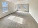 Bright bedroom with ceiling fan and plush carpeting at 7045 Treeline Dr, Cumming, GA 30028