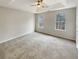 Bright bedroom with neutral walls and wall-to-wall carpeting at 7045 Treeline Dr, Cumming, GA 30028