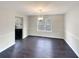 Dining room with dark hardwood floors and a chandelier at 7045 Treeline Dr, Cumming, GA 30028