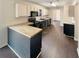 Modern kitchen with butcher block island and dark cabinetry at 7045 Treeline Dr, Cumming, GA 30028