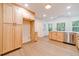 Modern kitchen with light wood cabinets, stainless steel appliances, and a large island at 1861 Shady Creek Ln, Lawrenceville, GA 30043