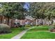 Brick building exteriors, lush landscaping, and walkways in a quiet community at 4282 Roswell Ne Rd # G2, Atlanta, GA 30342