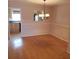 Bright dining room with hardwood floors and a chandelier at 4282 Roswell Ne Rd # G2, Atlanta, GA 30342