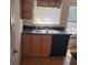 Kitchen features light wood cabinets, granite countertops, and modern appliances at 4282 Roswell Ne Rd # G2, Atlanta, GA 30342
