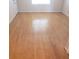 Large living area showcasing light hardwood floors at 4282 Roswell Ne Rd # G2, Atlanta, GA 30342