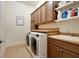 Bright laundry room with ample cabinetry and a convenient utility sink at 4668 Andrea Pointe, Marietta, GA 30062