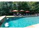 Relaxing pool area with multiple umbrellas and lounge chairs at 4668 Andrea Pointe, Marietta, GA 30062