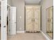 Bedroom with armoire, mirror, and door to the rest of the home at 4924 Red Cliff Ct, Powder Springs, GA 30127