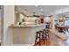 Well-lit kitchen with granite countertops, stainless steel appliances and barstool seating at 600 Beckenham Walk Dr, Dacula, GA 30019