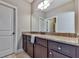 Bathroom boasts granite countertop and dark brown vanity at 217 Towering Peaks, Canton, GA 30114