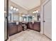 Bathroom featuring double sinks, granite countertop, and large mirror at 217 Towering Peaks, Canton, GA 30114