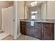 Bathroom with granite countertop and dark brown vanity at 217 Towering Peaks, Canton, GA 30114