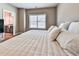 King-size bed in a well-lit bedroom with ensuite bathroom at 217 Towering Peaks, Canton, GA 30114