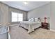 Spacious bedroom with carpeted floors and large window at 217 Towering Peaks, Canton, GA 30114