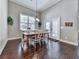 Bright dining room with wood floors and access to backyard at 217 Towering Peaks, Canton, GA 30114