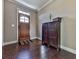 Bright entryway with hardwood floors, a wooden door, and a dark brown cabinet at 217 Towering Peaks, Canton, GA 30114