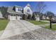 Two-story home with gray siding and brick at 217 Towering Peaks, Canton, GA 30114