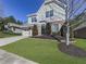 House exterior showcasing a driveway, landscaping, and neighborhood context at 217 Towering Peaks, Canton, GA 30114