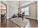 Home office with hardwood floors, a large window, and a standing desk at 217 Towering Peaks, Canton, GA 30114