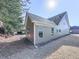 Gray house exterior showcasing large windows and yard at 217 Towering Peaks, Canton, GA 30114