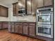 Kitchen with stainless steel appliances and dark wood cabinets at 217 Towering Peaks, Canton, GA 30114