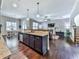 Open concept kitchen with island, overlooking living room at 217 Towering Peaks, Canton, GA 30114