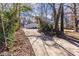 Driveway curving through a wooded area at 2698 George Nw St, Atlanta, GA 30318