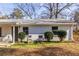 Side view of white brick duplex, showing landscaping at 2698 George Nw St, Atlanta, GA 30318