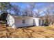 White brick house with a yard and trees at 2698 George Nw St, Atlanta, GA 30318