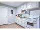 White kitchen with full-size appliances at 2698 George Nw St, Atlanta, GA 30318