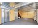 Unfinished basement with metal ceiling and shelving at 295 W 5 Hwy, Roopville, GA 30170