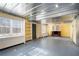 Unfinished basement with built-in shelving at 295 W 5 Hwy, Roopville, GA 30170