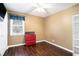 Cozy bedroom with dark wood floors and a red dresser at 295 W 5 Hwy, Roopville, GA 30170