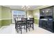 Dining room with green walls, hardwood floors, and a hutch at 295 W 5 Hwy, Roopville, GA 30170