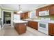 Bright kitchen with white appliances and an island at 295 W 5 Hwy, Roopville, GA 30170