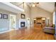 Open living area with hardwood floors, fireplace and high ceiling at 295 W 5 Hwy, Roopville, GA 30170