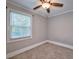 Simple bedroom with carpeted floor and ceiling fan at 3700 Ashley Woods Dr, Powder Springs, GA 30127