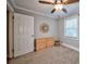 Bedroom with dresser, ceiling fan and neutral color scheme at 3700 Ashley Woods Dr, Powder Springs, GA 30127